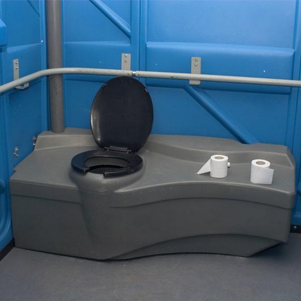 ada-compliant porta potties must have certain features, such as handrails, grab bars, and lower sinks